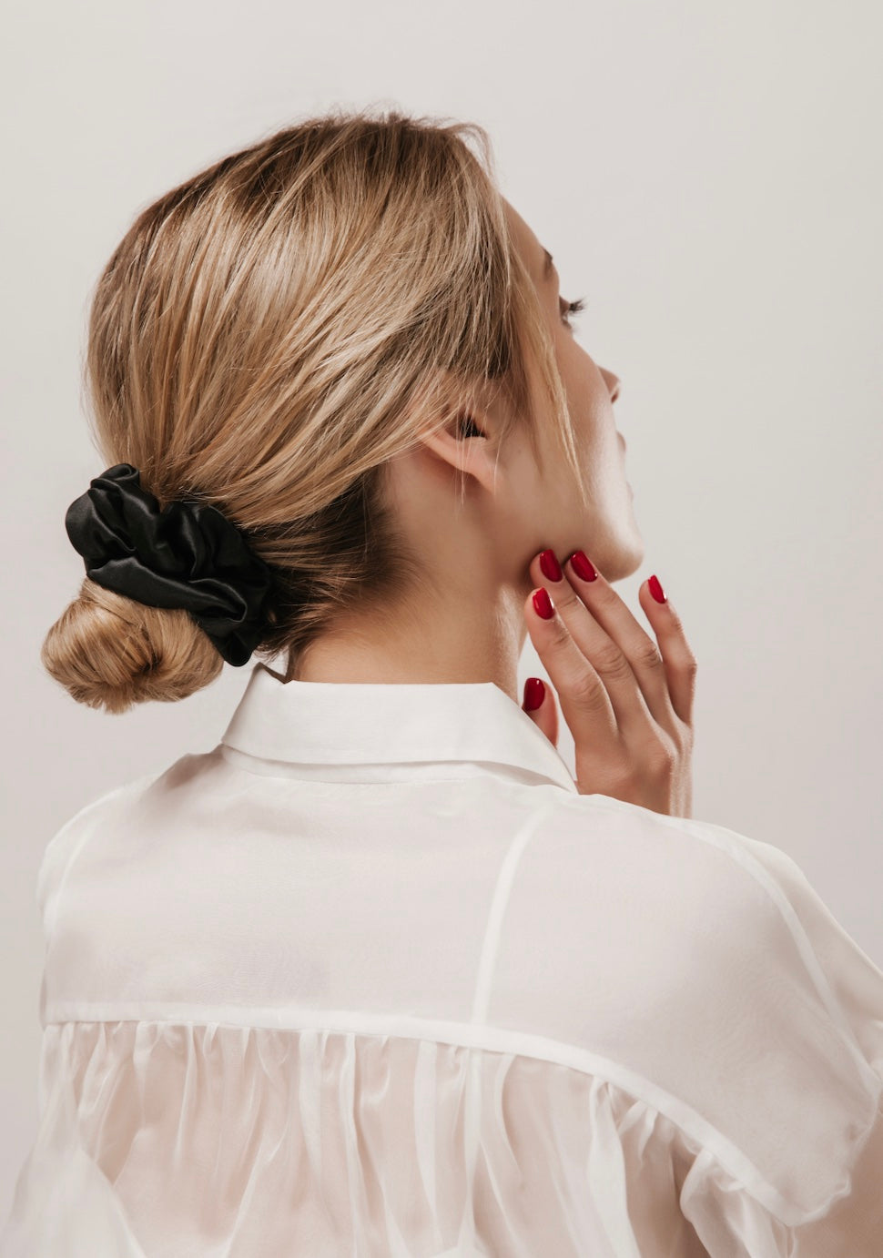 Blond hair female with hair scrunchie